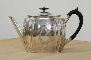 A Victorian silver teapot in the George III style,