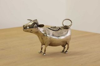 A silver cow cream jug,
