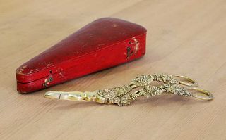A cased pair of George IV silver gilt grape scissors,