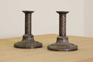 A pair of George III silver candlesticks,