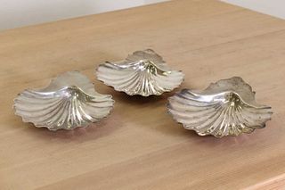 A set of three George III silver butter dishes,