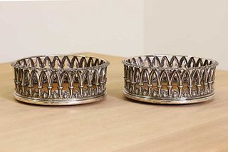 A pair of William lV silver decanter coasters,