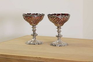 A pair of Victorian silver combination candlestick tazzas,