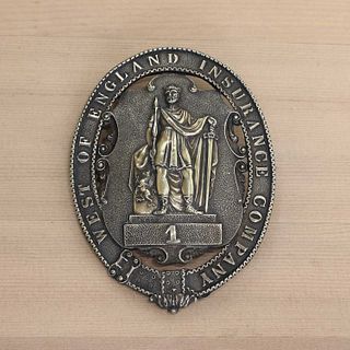 A William IV silver-gilt West of England Insurance Company fireman's badge,