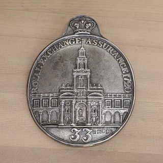 A George IV silver Royal Exchange Assurance fireman's arm badge,
