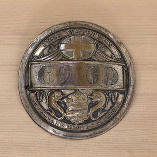 A silver plate on copper Free Waterman fireman's badge,