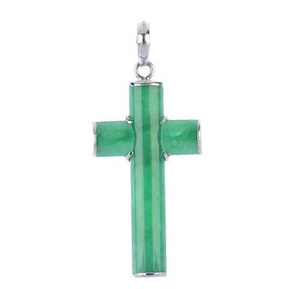 A jade cross pendant. The hemi-cylindrical jadeite panels, forming a cross, suspended from a tapered
