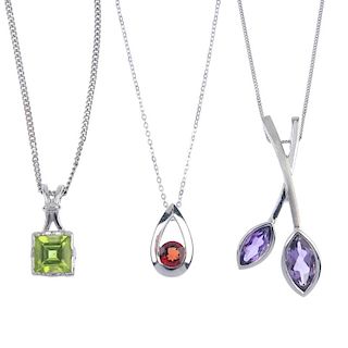 A selection of three gem-set pendants. To include a 9ct gold square-shape peridot pendant, a 9ct gol