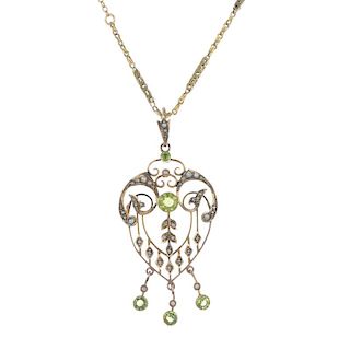An early 20th century 9ct gold garnet-topped-doublet and split pearl pendant. Of openwork design, th
