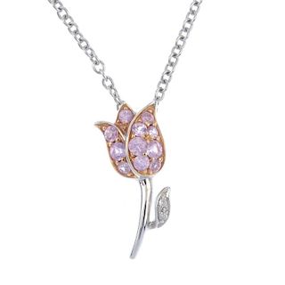 A sapphire and diamond floral pendant. The circular-shape pink sapphire tulip, with tapered stem and