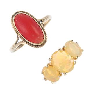 A selection of four gem-set rings. To include a 9ct gold opal three-stone ring, a 9ct gold coral sin