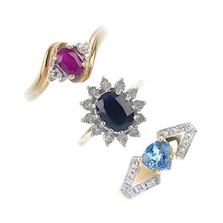 A selection of three 9ct gold gem-set rings. To include a sapphire and diamond cluster ring, a ruby