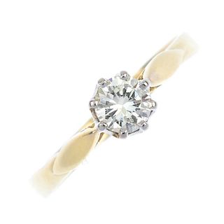 An 18ct gold diamond single-stone ring. The brilliant-cut diamond, to the foliate shoulders and plai