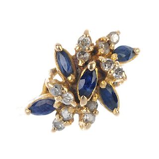 A diamond and sapphire dress ring. The marquise-shape sapphire and brilliant-cut diamond abstract cl