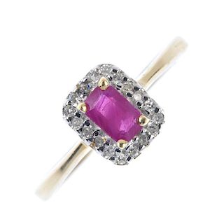 A 9ct gold ruby and diamond cluster ring. The rectangular-shape ruby, within a single-cut diamond su