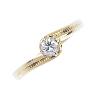 A diamond crossover ring. The brilliant-cut diamond, to the grooved asymmetric shoulders and plain b