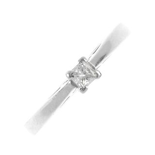 A platinum diamond single-stone ring. The square-shape diamond, to the tapered band. Diamond weight