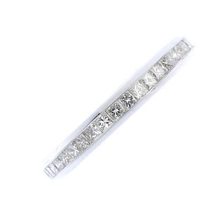 * An 18ct gold diamond half-circle eternity ring. The square-shape diamond channel-set line, to the