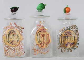 Three Brown-Painted Glass Apothecary Jars