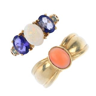 A selection of four gold gem-set rings. To include a 9ct gold aquamarine three-stone ring, a 9ct gol