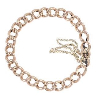 An early 20th century 9ct gold bracelet. The curb-link chain, to the partially concealed clasp. Leng