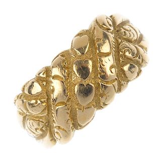 An Edwardian 18ct gold ring. Designed as a textured interwoven panel, to the tapered band. Hallmarks