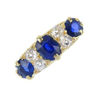 An early 20th century 18ct gold sapphire and diamond ring. The graduated cushion-shape sapphire line