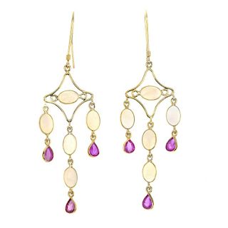A pair of opal and ruby ear pendants. Each design as an oval opal cabochon and pear-shape ruby gradu