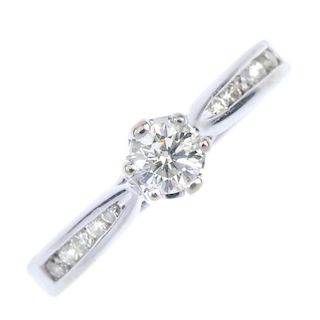 An 18ct gold diamond single-stone ring. The brilliant-cut diamond, to the similarly-cut diamond, cha