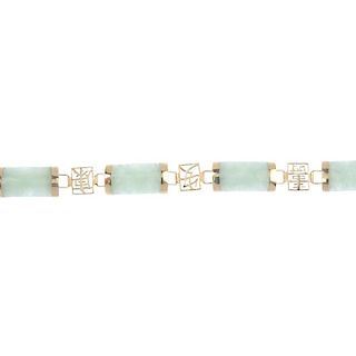 A 9ct gold jade bracelet. Designed as a series of rectangular jadeite panels, with oriental openwork