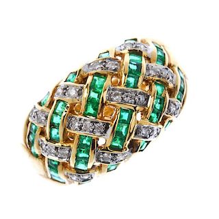 A diamond and emerald dress ring. Of openwork design, the square-shape emerald and brilliant-cut dia