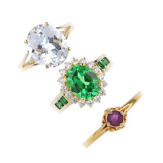 A selection of three gem-set rings. To include an aquamarine single-stone ring, a 14ct gold green pa