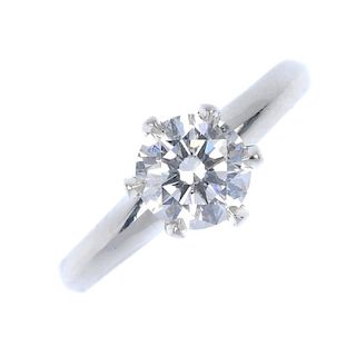 A diamond single-stone ring. The brilliant-cut diamond, weighing 0.70ct, to the tapered band. Accomp
