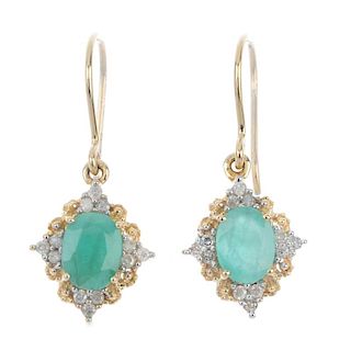 Two pairs of emerald and diamond earrings. The first pair each designed an oval-shape emerald and di