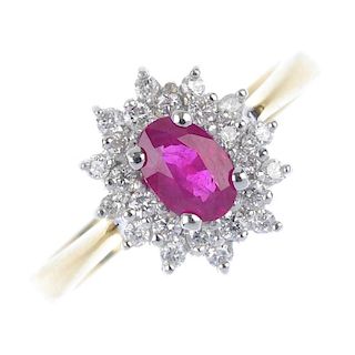 * An 18ct gold ruby and diamond cluster ring. The oval-shape ruby, within a brilliant-cut diamond do