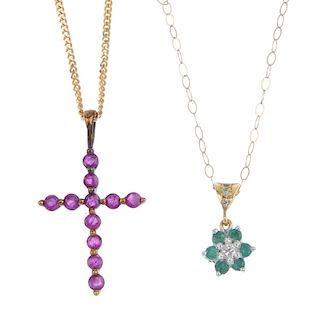 A selection of three gem-set pendants. To include a 9ct gold ruby cross pendant, a diamond and emera