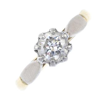 A diamond single-stone ring. Of bi-colour design, the brilliant-cut diamond, to the plain band. Esti