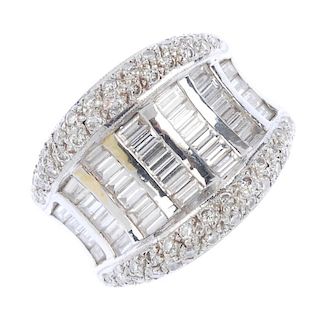 A diamond dress ring. The baguette-cut diamond lines, with polished bar spacers, to the pave-set dia