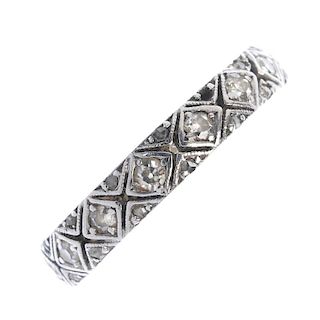 A diamond band ring. Designed as a lattice motif, set with a series of single-cut diamonds. Estimate