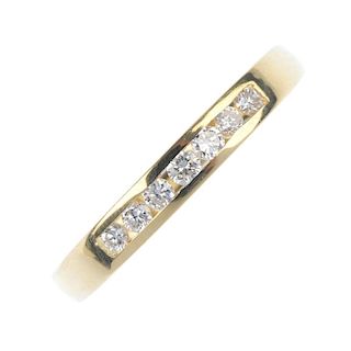 An 18ct gold diamond half-circle eternity ring. The brilliant-cut diamond line, inset to the plain h