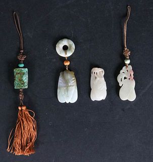 Four Carved Jade and Hardstone Pendants