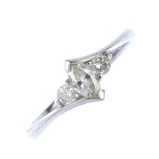 An 18ct gold diamond crossover ring. The marquise-shape diamond, with brilliant-cut diamond sides, t