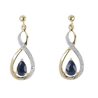 A pair of 9ct gold sapphire and diamond ear pendants. Each designed as a pear-shape sapphire, within