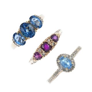 A selection of three 9ct gold diamond and gem-set rings. To include a blue topaz ring, a ruby three-