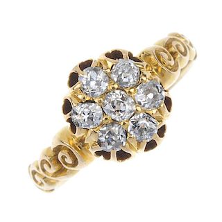 An early 20th century 18ct gold diamond cluster ring. The old-cut diamond, within a similarly-cut di