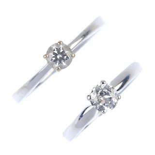 Two 18ct gold diamond single-stone rings. Each designed as a circular-cut diamond, to the tapered sh