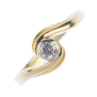 An 18ct gold diamond single-stone ring. The brilliant-cut diamond collet, to the crossover grooved s