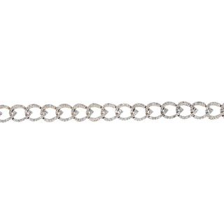 A 9ct gold diamond bracelet. Designed as a series of interlinked single-cut diamond tapered links, t