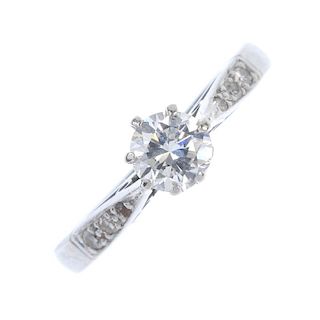 A mid 20th century 18ct gold and platinum diamond single-stone ring. The circular-cut diamond, to th