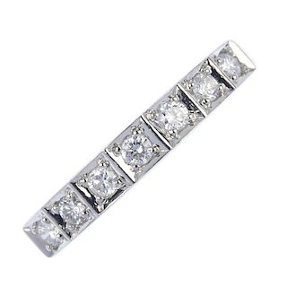 A 9ct gold diamond half-circle eternity ring. The brilliant-cut diamond line, each within a square-s